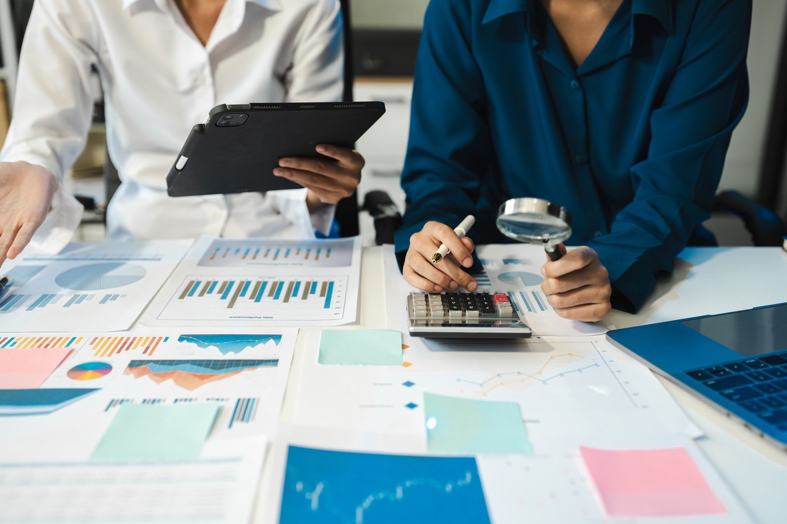 financial advisor showing plan of investment to clients in the consultancy.